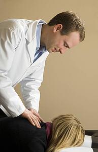 Chiropractor with his patient
