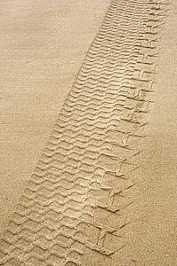 Tire tracks in the sand