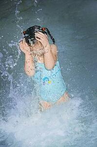 Girl splashing in the water