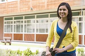 Student standing outdoors smiling