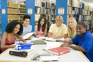Six people in library studying