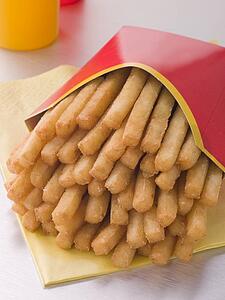 French Fries In A Box With Sauce Bottles
