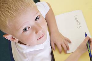 Student in class learning spelling (selective focus)