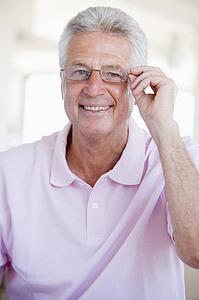 Man Looking Through New Glasses