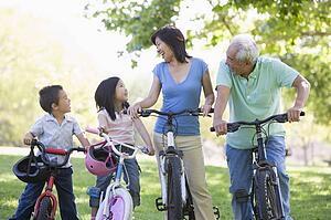 Grandparents bike riding with grandchildren.