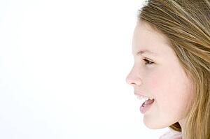 Teenage girl standing with mouth open