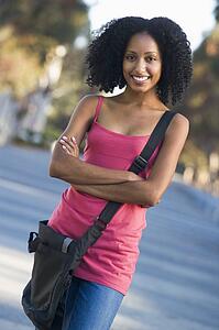 Women standing outdoors smiling (selective focus)