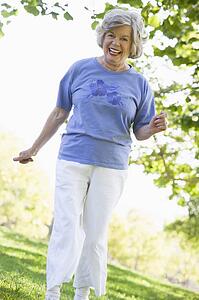 Senior woman walking in park