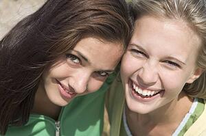 Two young women posing outdoors