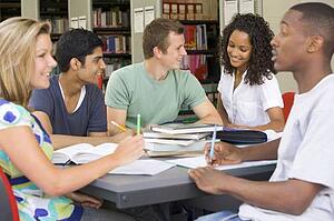 Five people in library studying (selective focus)