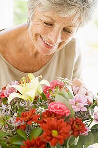 Woman with flowers smiling