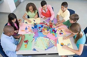 Teacher and students in art class