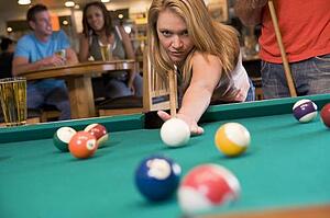 Woman playing pool