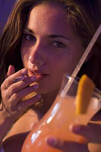 Young woman in a bar smoking