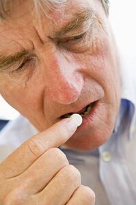 Man Taking Pills