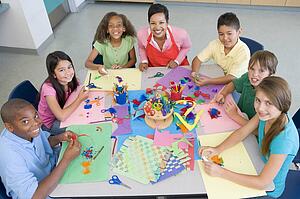 Teacher and students in art class