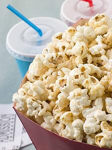 Bucket Of Popcorn With Soft Drinks And Cinema Tickets