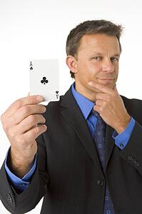 Businessman Holding The Ace Of Clubs 