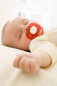 Baby lying indoors sleeping