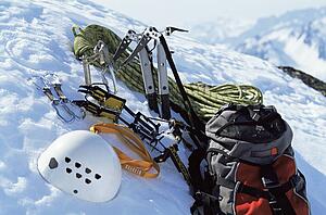 Mountain climbing equipment on a snowy mountain (selective focus)