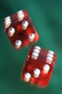 Dice rolling on a poker table (close up/blur)