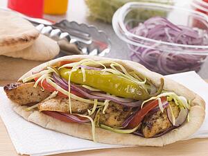 Marinated Chicken Kebab In A Pitta Bread With Salad And A Pickled Chilli