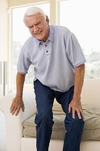 Senior Man Trying To Sit Down