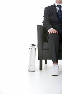 Businessman Sitting Wearing Sneakers
