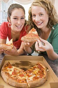 Teenage Girls Eating Pizza 