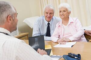 Couple in doctor's office smiling