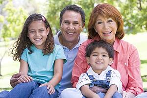 Grandparents posing with grandchildren.