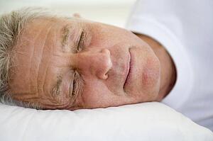 Man lying in bed sleeping