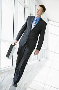 Businessman walking in corridor