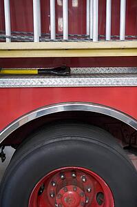 Side view of a fire engine with ladder
