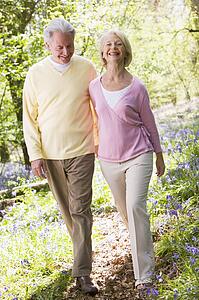 Couple walking outdoors smiling