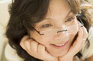 Woman Looking Through New Glasses