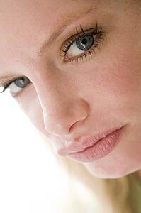 Head shot of woman scowling