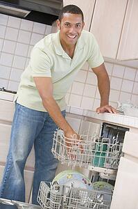 Man Loading Dishwasher 