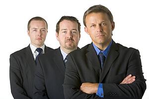 Group Of Businessmen Looking Stern 