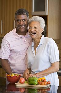Husband And Wife Preparing meal, mealtime Together