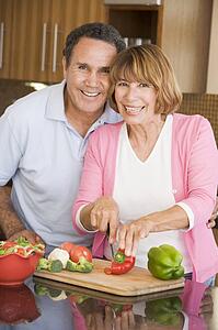 Husband And Wife Preparing meal, mealtime Together