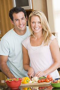 Husband And Wife Preparing meal, mealtime Together