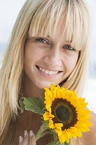 Woman holding a sunflower