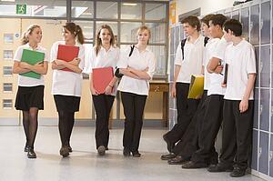Secondary school students in a school hallway