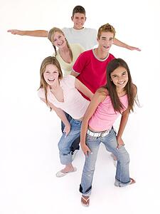 Five friends in a row smiling