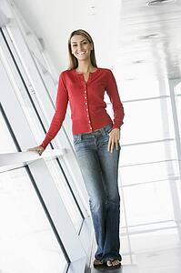 Woman standing in corridor smiling