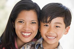 Woman and young boy smiling