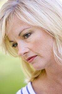 Head shot of woman thinking