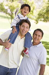 Grandfather with adult son and grandchild