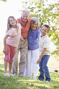 Grandparents laughing with grandchildren.